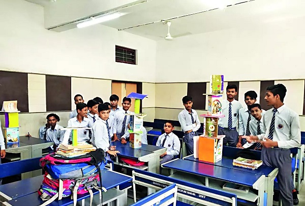 School students are in the classroom and have made small building blocks with books